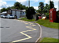 Red phonebox at a bend in Duffryn Road, Llangynidr