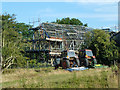 Barn skeleton and tractors, Stocks Farm