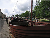 SU4111 : Replica barge beneath Southampton town wall by Rudi Winter