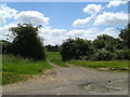 Gate opposite houses at Albourne Farm