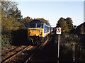 Train approaching Axminster station - 1991