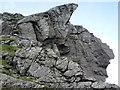 NN2605 : Spectacular overhangs of the north Peak of "The Cobbler" by Peter S