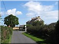 A large Edwardian former farmhouse at the junction of the Ballyhosset and Tullynaskeagh Roads