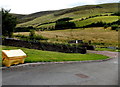 Yellow grit box on a bend in Blaengarw