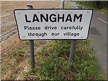 TM0333 : Langham Village Name sign by Geographer