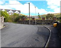 Yellow grit box at a bend in Hill View, Pontycymer