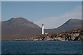 NR4279 : Rubh' a' Mhail lighthouse with the Paps of Jura by Becky Williamson