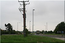 SK9778 : Power lines by the A15 roundabout (junction with Horncastle Lane) by Chris