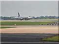 SJ8184 : Airbus A319 Landing at Manchester Airport by David Dixon