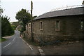 New build rounded building on the corner of the Blackmoor Foot Road in Holt Head