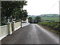 H8819 : Corliss Road approaching the junction with Drumlougher Road by Eric Jones