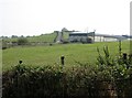 Drumlin top farmhouse and nearby farm sheds off the Drumlougher Road