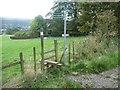 Footpath signpost and stile, south side, Hardings Lane