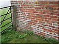 O/S  Bench  Mark  on  outbuilding  at  Northfield  Farm