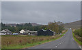 NY5610 : The A6 passing Shap Lodge by Nigel Brown