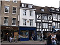 Shops in King?s Parade, and plaque to Edward Fitzgerald