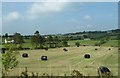 J0126 : Hay bales north of the A25 by Eric Jones
