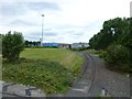 Railway crosses a roundabout at Trafford Park