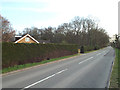 SP0873 : House behind clipped conifer hedges by Forshaw Heath Lane by Robin Stott