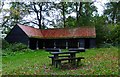 Picnic area and barn by Little Wix Wood