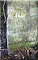 Benchmark on end of wall at Bladon Roundabout