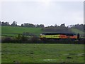SX9685 : Colas freight train on railway line south of Exeter  by David Smith