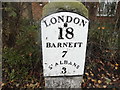 Cast iron milestone plate on High Street, London Colney