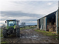 NH7058 : Farm buildings and tractor at Boggiewell by Julian Paren