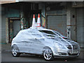 A car wrapped in cling film