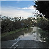 TL4945 : Road liable to flooding by John Sutton