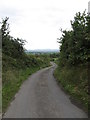 The descending Goward Road with distant views of the Slieve Croob range