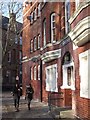 Glazed brick, red & buff brick with stone details