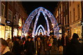 View of arched Christmas decorations on South Molton Street