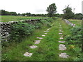 Former tramway with stone sleepers running S from Minions