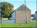 Former farmhouse converted into an agricultural building 