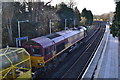 Class 66 locomotive standing at Cobham & Stoke D