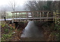 ST0414 : Wooden footbridge over Spratford Stream by Jaggery