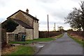 A rural road passes Grange Farm