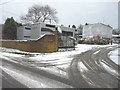 Outbuilding shrouded in polythene sheeting at School House, School Road