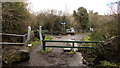 Boulders and barrier at the edge of a riverside cycle route, Penywaun