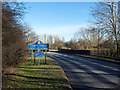 Two blue and yellow road signs