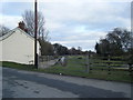 Old level crossing and course of railway at Llong