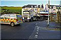 An Evolution 38 and a DAF XF510 emerging from St James