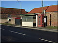 Bus stop, shelter and phone box on Main Road, Haisthorpe