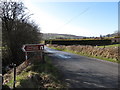 Guide post on Ferryhill Road pointing the way to the Clontygora Court Tomb