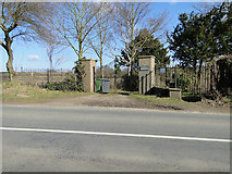 TM3869 : Memorial cemetery gates at Yoxford by Adrian S Pye