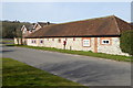 Old farm building with post box