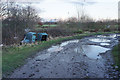 Puddly land and fly-tipping near Wincham