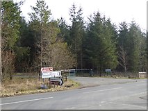 NY5525 : Road junction and forest entrance by Oliver Dixon