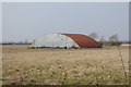 Large barn in large field